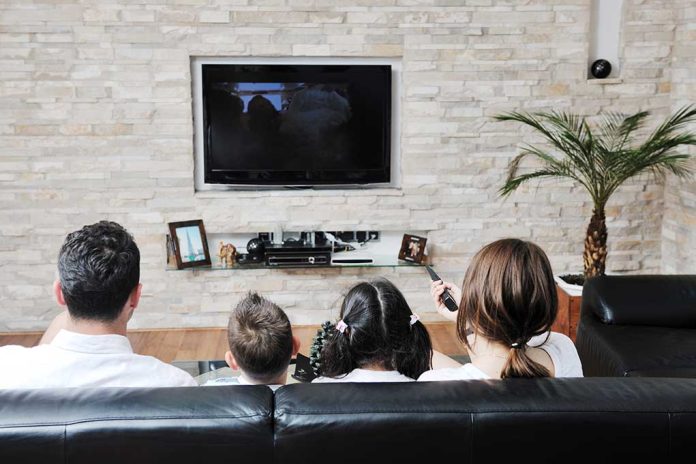 Happy,Young,Family,Wathching,Flat,Tv,At,Modern,Home,Indoor