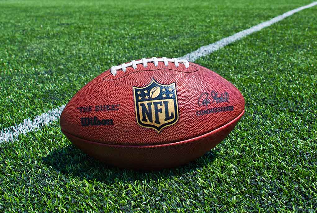 205708945 featured image NFL football on a green field.