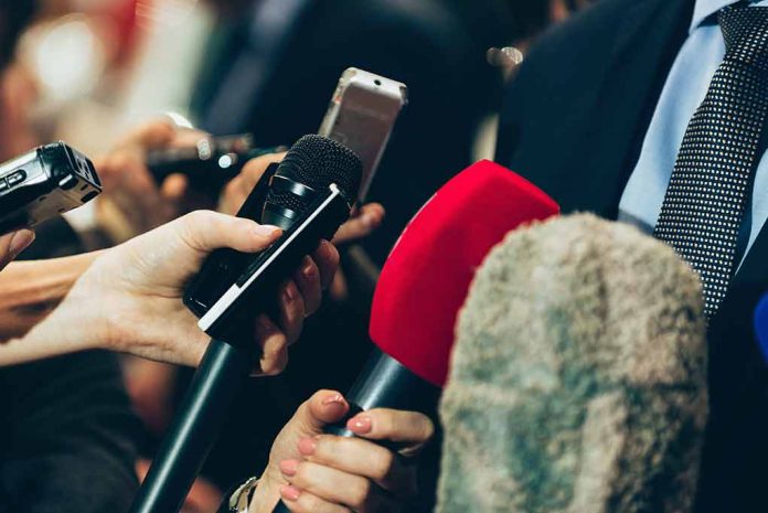 461773729 featured image Close-up of various microphones held towards a person.