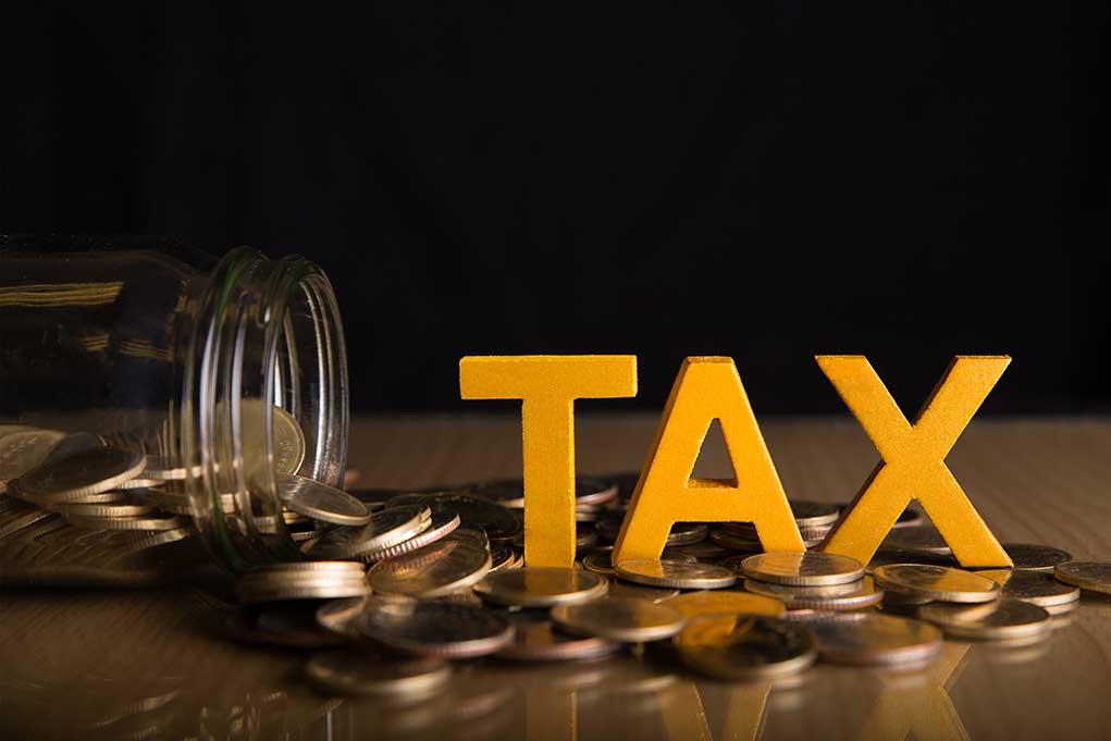 1181145091 featured image "Tax letters with spilled jar of coins."
