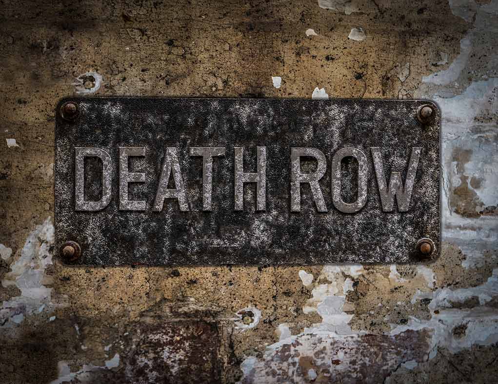 533872477 featured image Weathered Death Row sign on aged concrete wall