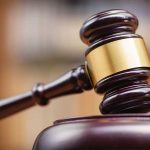 Judges gavel on a wooden block courtroom setting