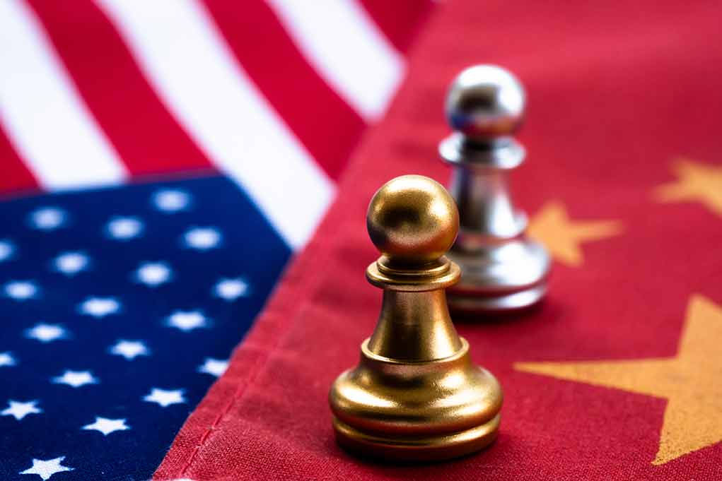 1369121363 featured image Chess pawns on USA and China flags.