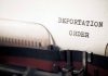 Typewriter with paper saying deportation order