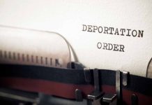 Typewriter with paper saying deportation order