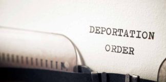Typewriter with paper saying deportation order
