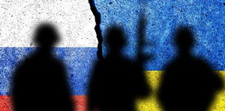 Three soldier silhouettes against split Russia Ukraine flags
