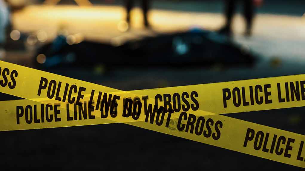 2230640045 featured image Police tape marking a crime scene at night.