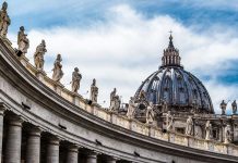 Large dome with statues on curved building