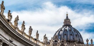 Large dome with statues on curved building