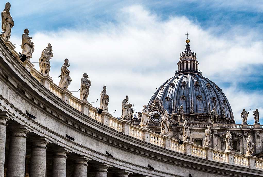 Large dome with statues on curved building