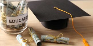 Graduation cap with money rolls and jar labeled Education.