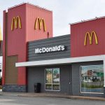McDonald's restaurant exterior with logo and drive-thru sign.