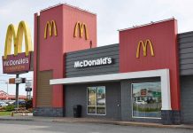McDonald's restaurant exterior with logo and drive-thru sign.