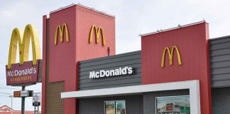 McDonald's restaurant exterior with logo and drive-thru sign.