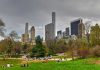 City skyline with park and people relaxing