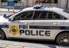 FBI police car parked on city stret