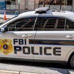 FBI police car parked on city stret