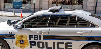 FBI police car parked on city stret