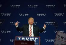 Man giving thumbs up at a Trump Pence rally