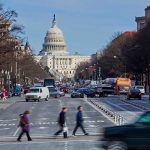 People crossing street near the U S Capitol building
