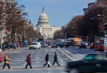 People crossing street near the U S Capitol building