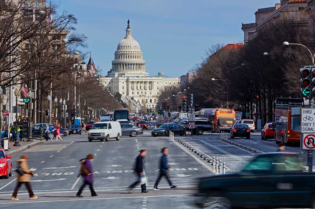 People crossing street near the U S Capitol building