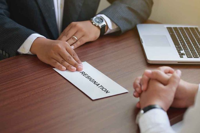 2042425985 featured image Handing in a resignation letter across a table