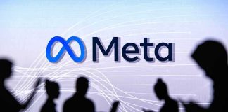 People silhouetted against Meta logo background