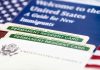 Permanent resident cards with welcome guide and flag