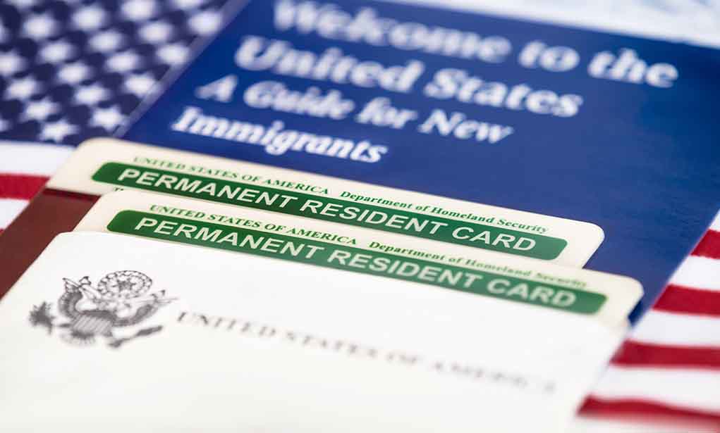 232231384 featured image Permanent resident cards with welcome guide and flag