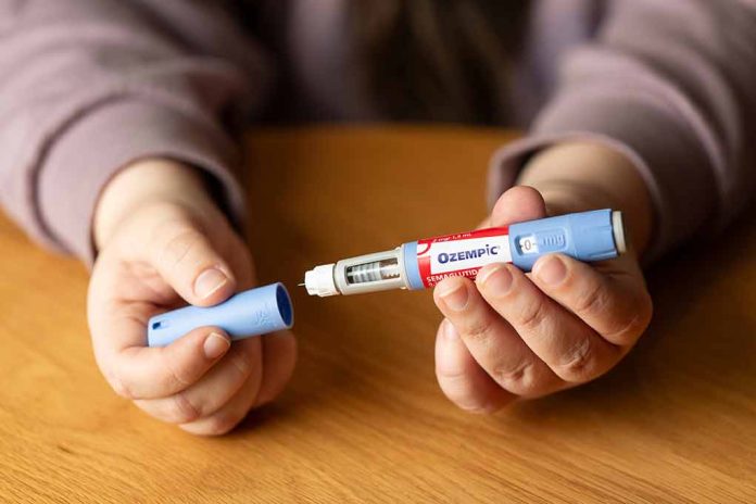 2349255139. featured image Hands holding an Ozempic injection pen