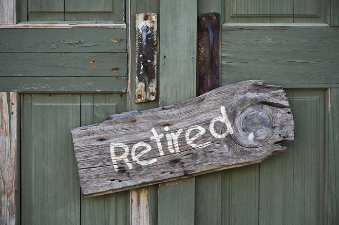 149656133 Rustic retired sign on green wooden door
