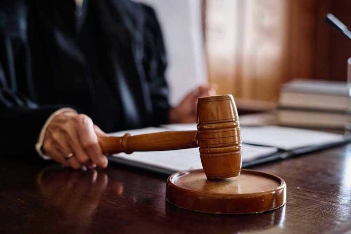 2378803063 Judge holding gavel in courtroom