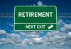 Green road sign reading retirement next exit sky background
