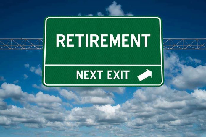 Green road sign reading retirement next exit sky background