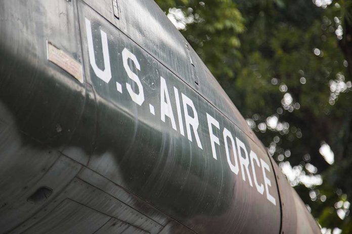 624049181 US Air Force plane with trees in background