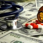 Stethoscope and prescription pills on a background of dollar bills
