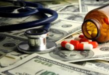Stethoscope and prescription pills on a background of dollar bills