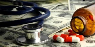 Stethoscope and prescription pills on a background of dollar bills
