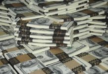 Piles of bundled cash stacked together