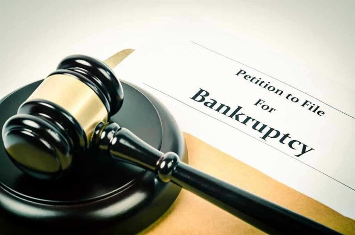 1018623748 Gavel on bankruptcy petition document