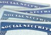 Several Social Security cards stacked together