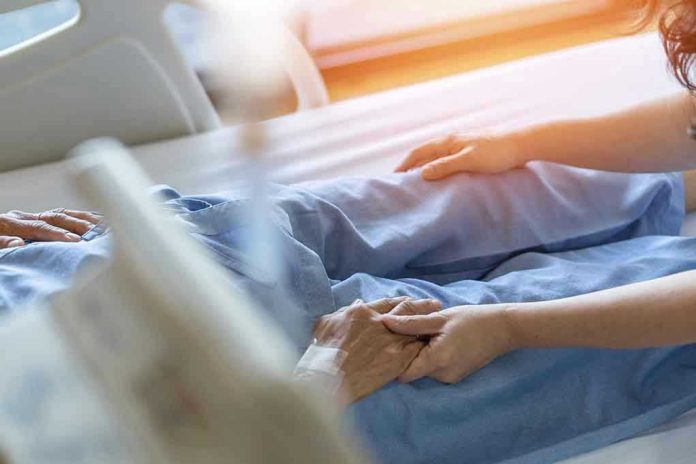 Hospital patient holding visitor's hand reassuringly