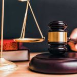 Gavel and scales on a judges desk