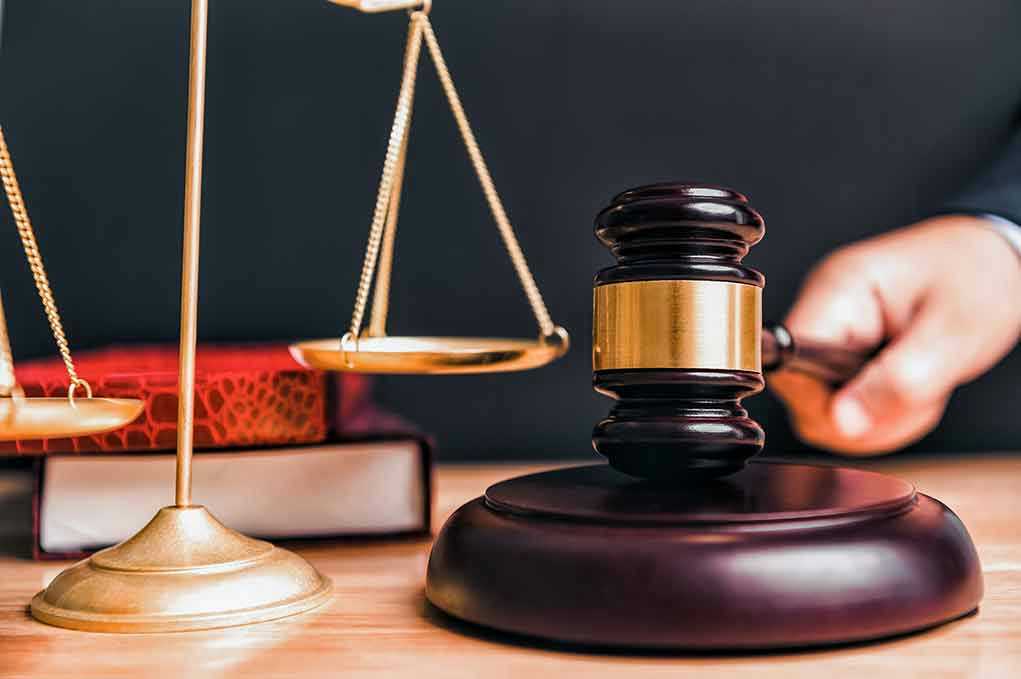 Gavel and scales on a judges desk