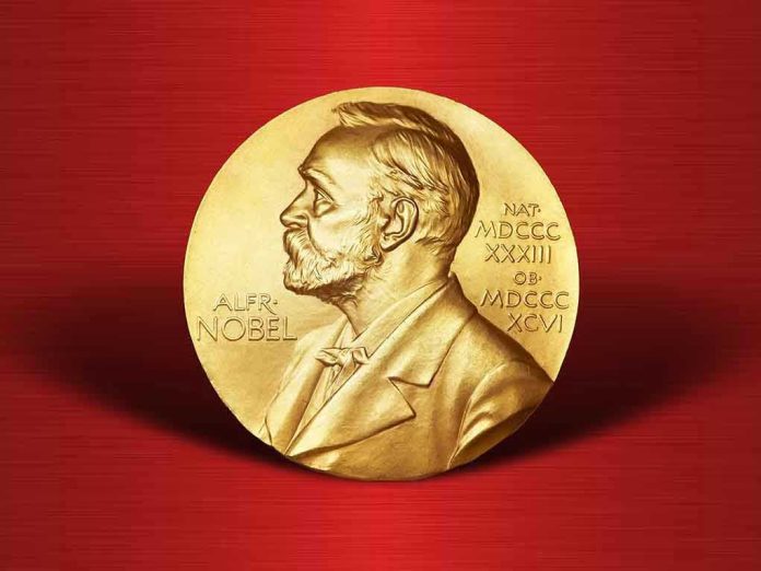 521945908 Gold Nobel Prize medal on red background