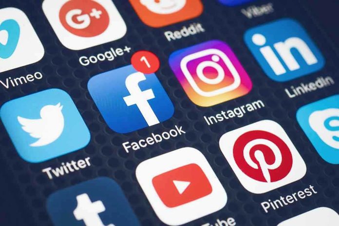 573033001 Social media app icons displayed on a smartphone screen