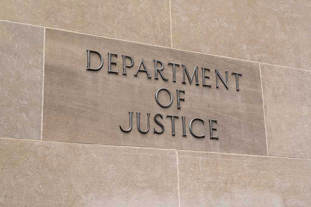 Department of Justice sign on a building