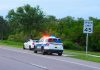 Police car pulling over a white car